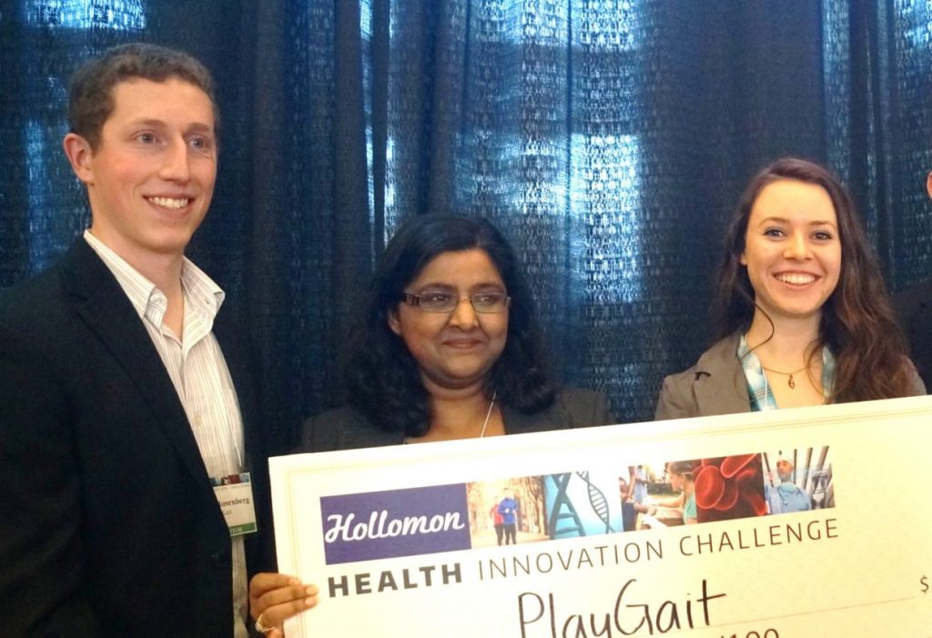 The PlayGait team holds up their winning check for the health innovation challenge