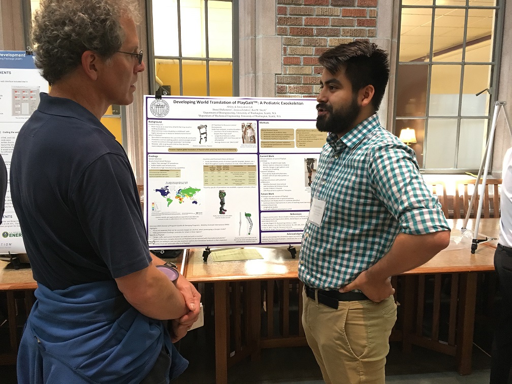 Daniel fields a question from a member of the University of Washington community during his poster session at Mary Gates Hall.