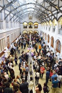 The interior courtyard of Mary Gates Hall has interior windows and a combination of new and old architectural elements. This is the location where hundreds of undergraduate presenters and community members discuss research accomplishments and next steps.