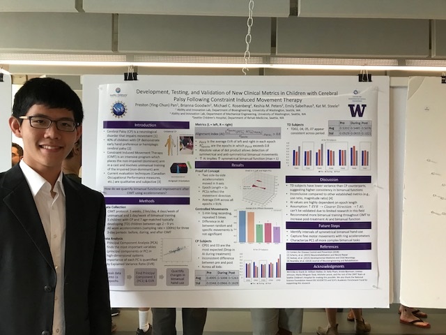 Preston Pan, in a white collared shirt and blazer, stands in front of his scientific poster evaluated a proposed motion tracking algorithm for bimanual movement.