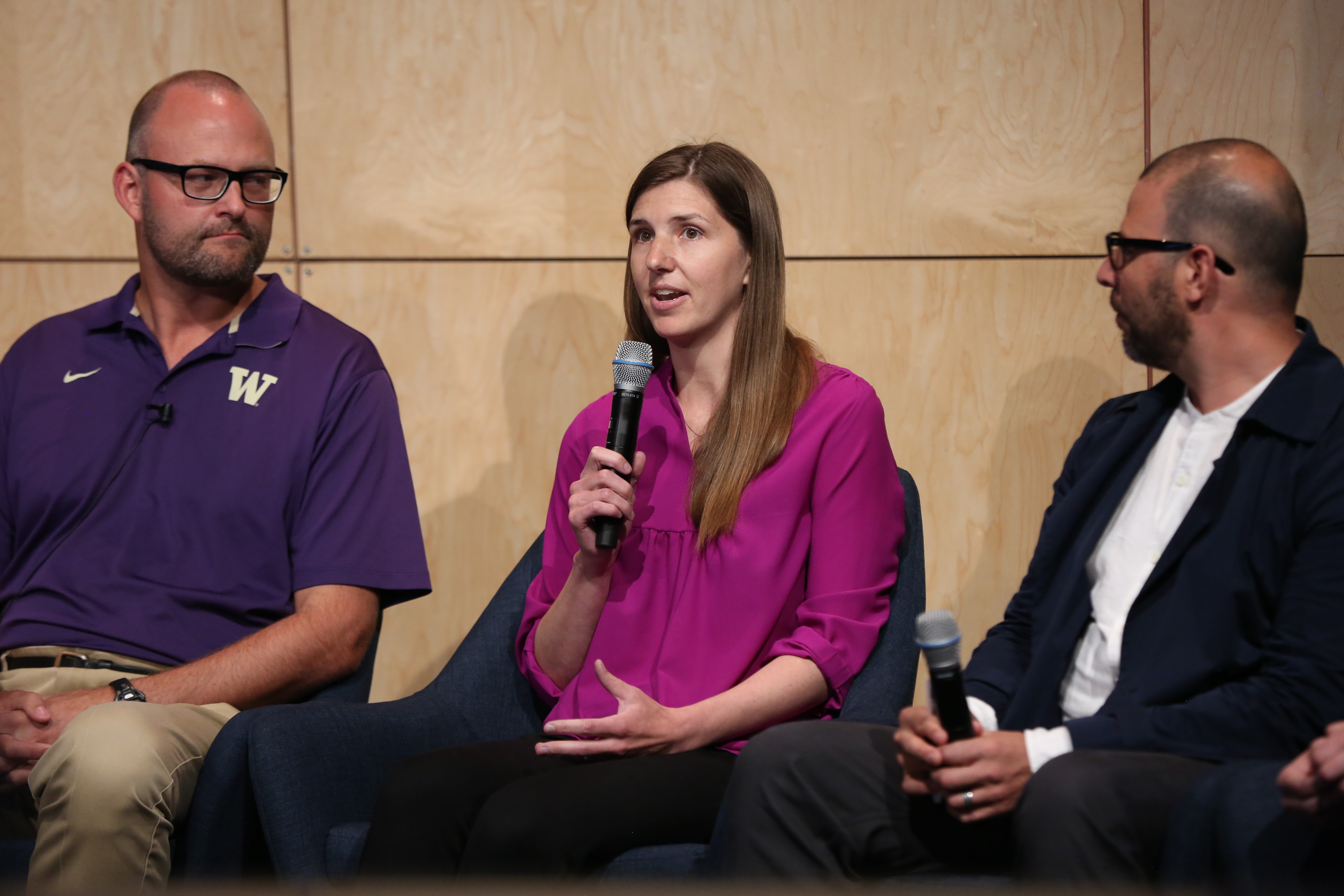 Kat Steele with microphone seated next to Jacob Wobbrock and Oscar Murillo on the panel.