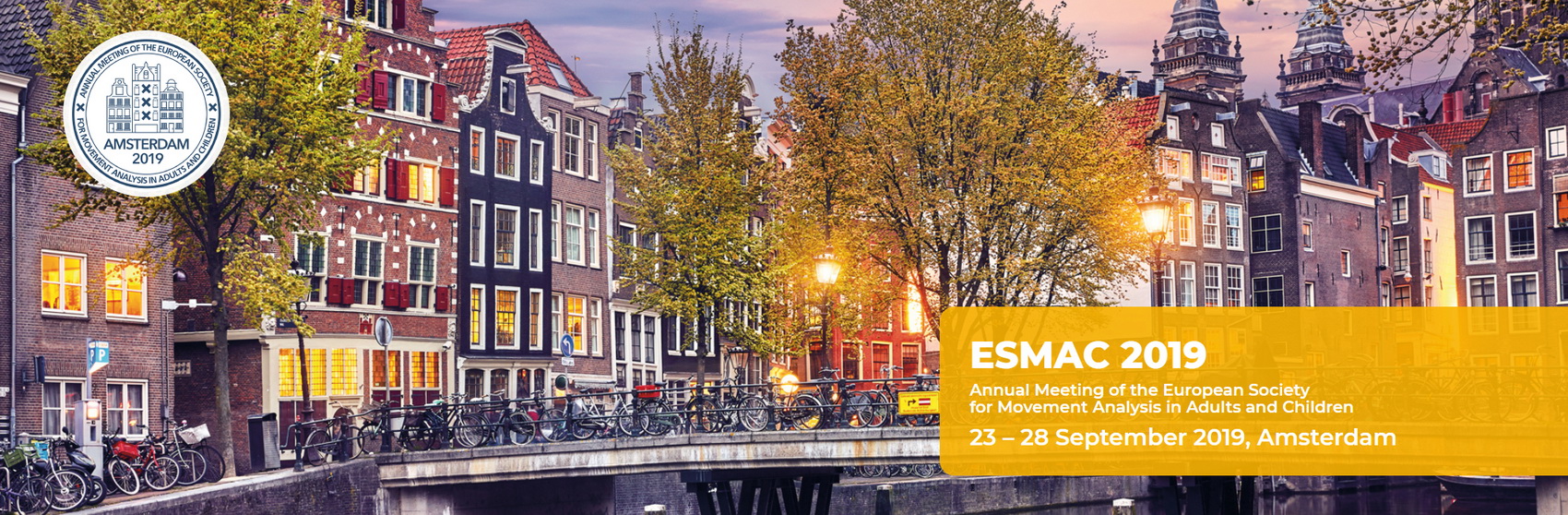 Logo for the 2019 ESMAC meeting overlaid on a classic Amsterdam scene, bikes lined up on a bridge over a canal with historic buildings in the background.