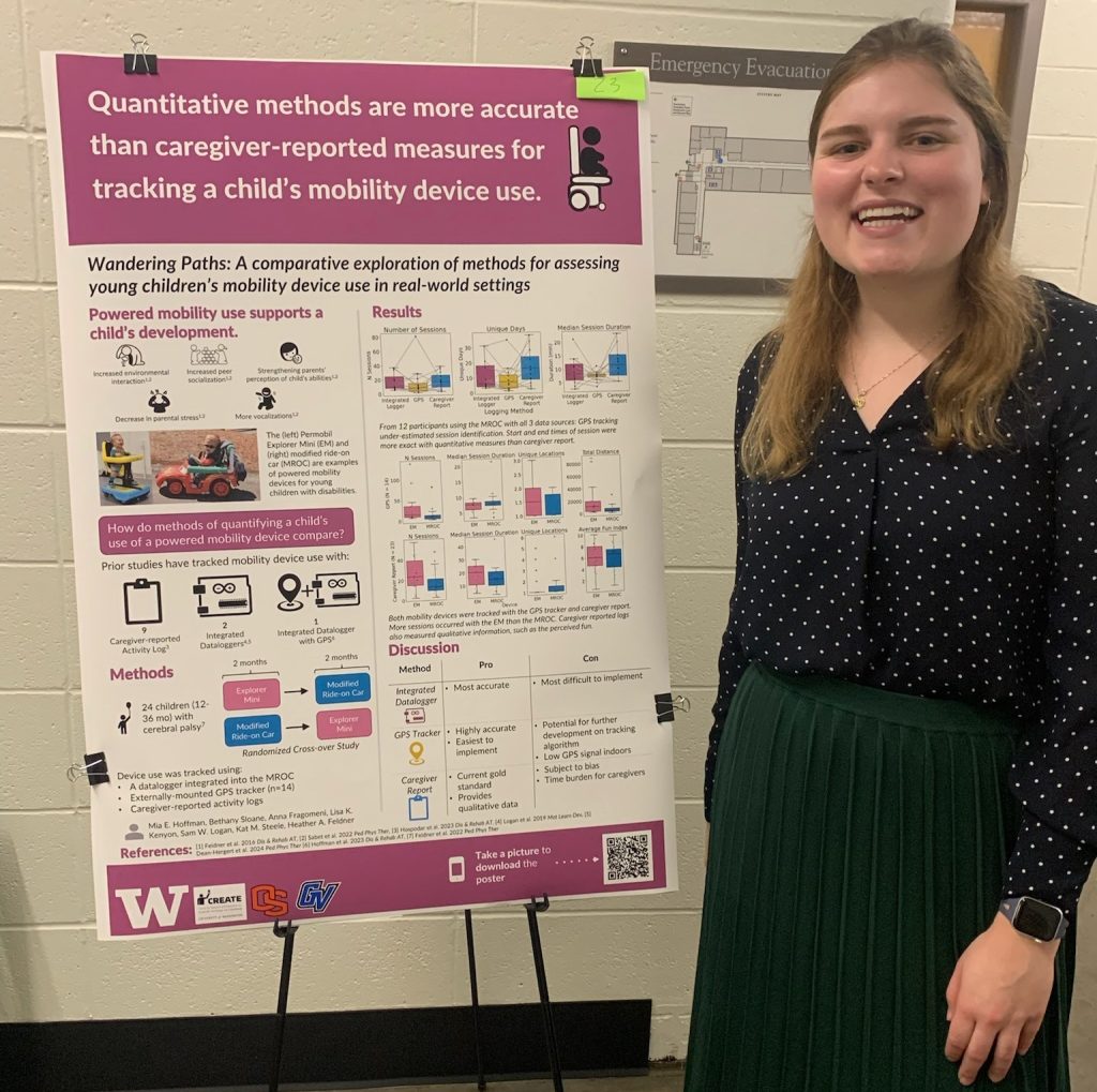 Mia has blonde hair and is wearing a polka dot blouse with a green skirt. She is standing next to her poster on "Quantitative methods are more accurate than caregiver-reported measures for tracking a child's mobility device use."