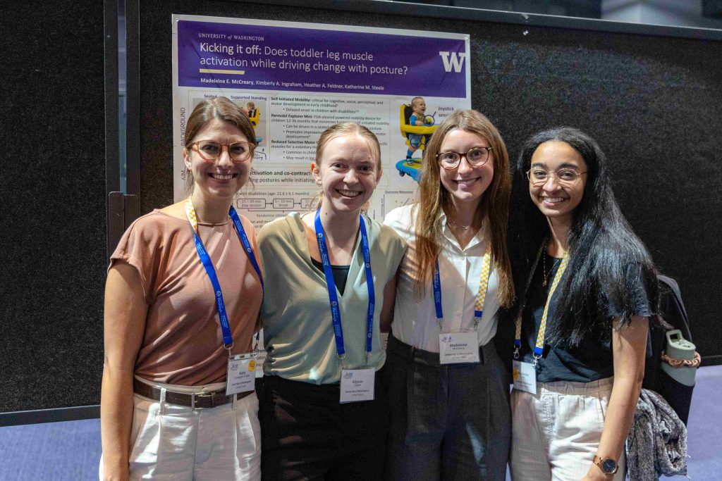 Four individuals standing in front of a research poster at ASB 2025, representing the University of Washington.